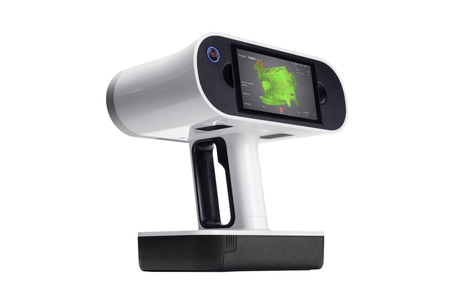 A handheld 3D scanner with a pivoting head and screen, mounted on a black grip handle, designed for capturing digital models of physical objects.