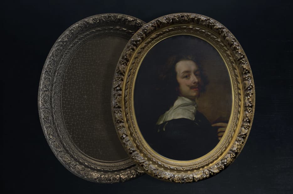 An oval miniature portrait of a man in 17th-century attire, set in an ornate gilt frame with an intricate design, half of which is covered by a dark, protective cover.